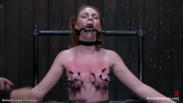 Veliki Gagged redhead slave Marie McCray is straddled on Sybian on knees with body bound in metal device gets tongue and skin clamped by master Orlando novi filmi